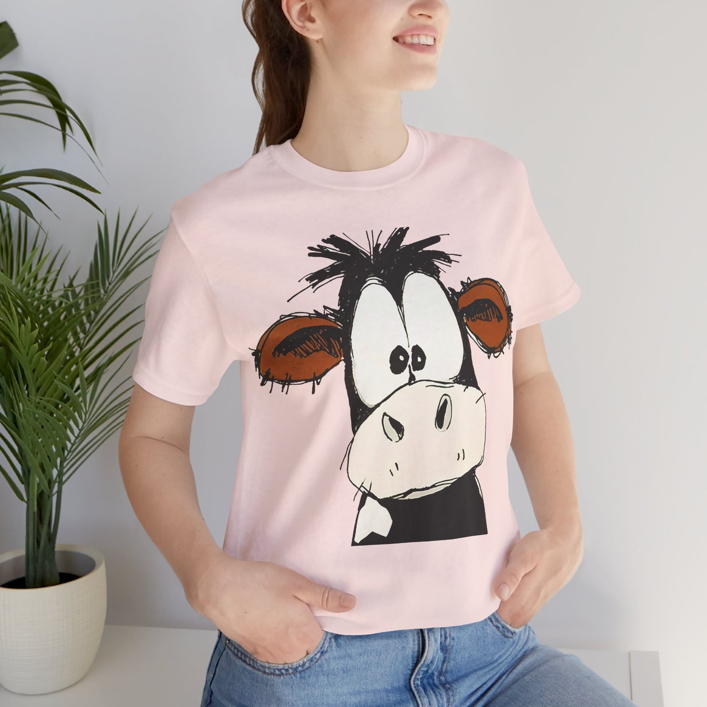 This STARTLED COW CARTOON Tee gives off a fun and quirky vibe, perfect for casual wear or as a statement piece. Ideal for those who love unique and whimsical designs.