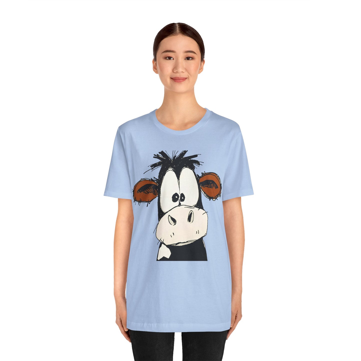 This STARTLED COW CARTOON Tee gives off a fun and quirky vibe, perfect for casual wear or as a statement piece. Ideal for those who love unique and whimsical designs.