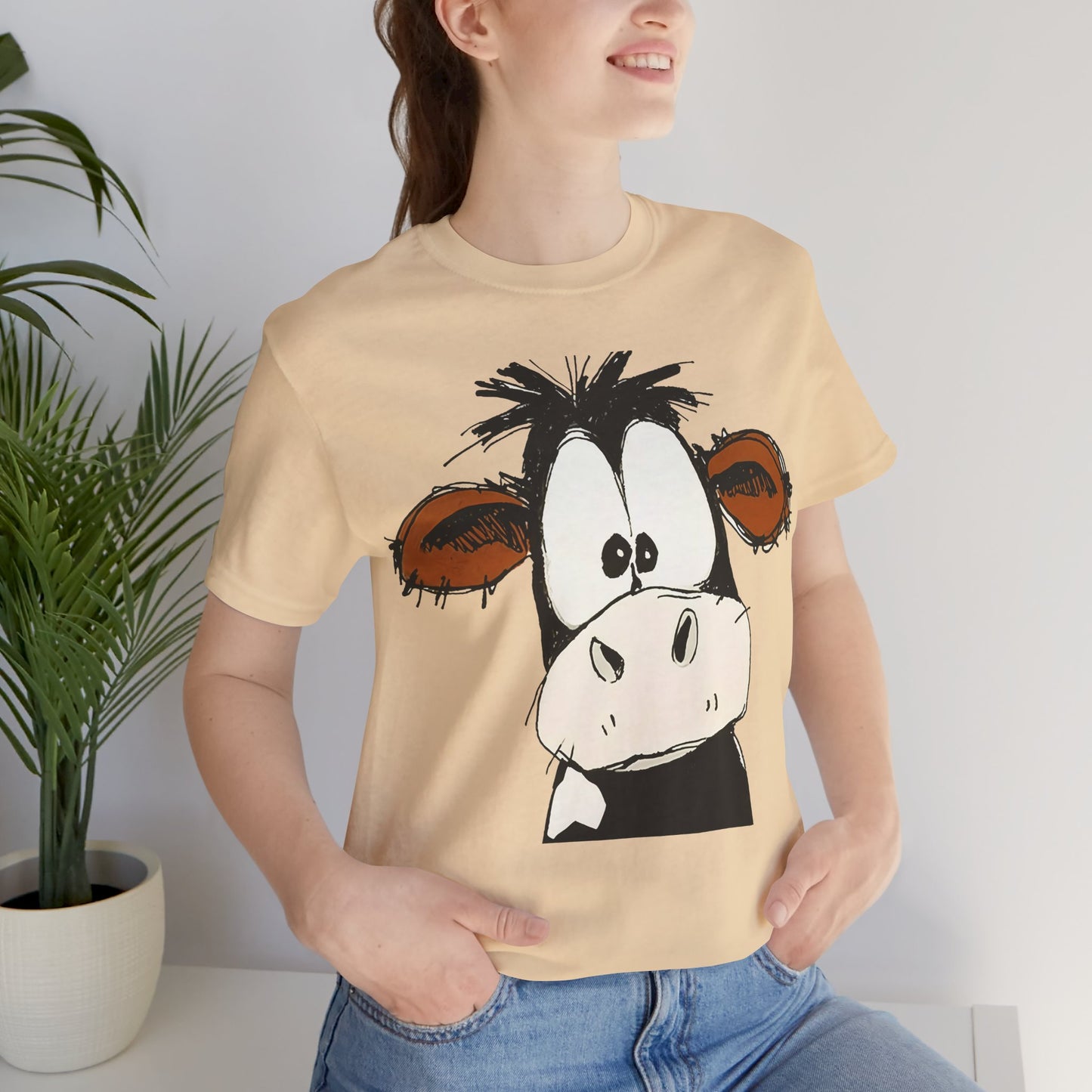This STARTLED COW CARTOON Tee gives off a fun and quirky vibe, perfect for casual wear or as a statement piece. Ideal for those who love unique and whimsical designs.