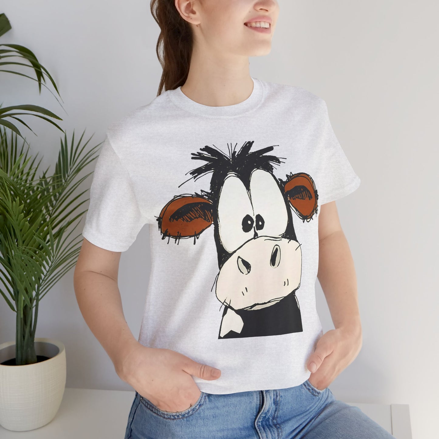 This STARTLED COW CARTOON Tee gives off a fun and quirky vibe, perfect for casual wear or as a statement piece. Ideal for those who love unique and whimsical designs.